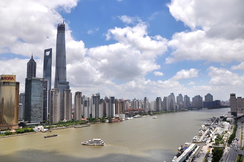 What major river flows by Shanghai?